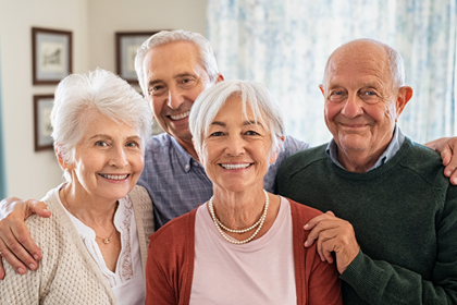 Emergency Medical Alert four seniors in the room smiling text read ”We keep seniors safe everywhere in America!”